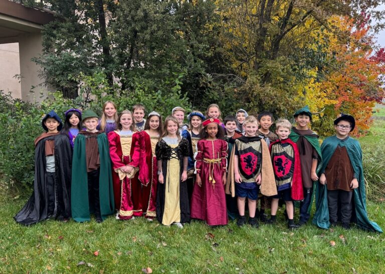 The fourth grade class dressed up in costume for their play The Reckoning.
