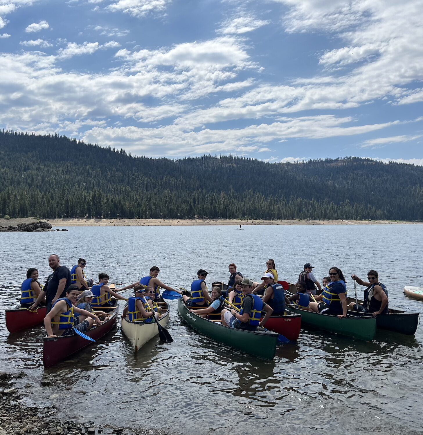 High Schoolers enjoy canoes on a camping trip field trip.