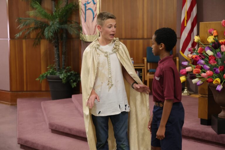 A middle school boy acts as Pilgrim in Pilgrim's Progress.