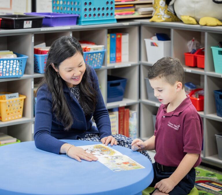Teacher reads one-on-one with a kindergarten student!